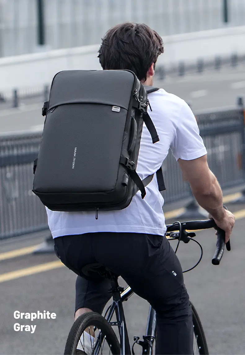 Cyclist wearing Mark Ryden MR8057 laptop backpack in graphite gray