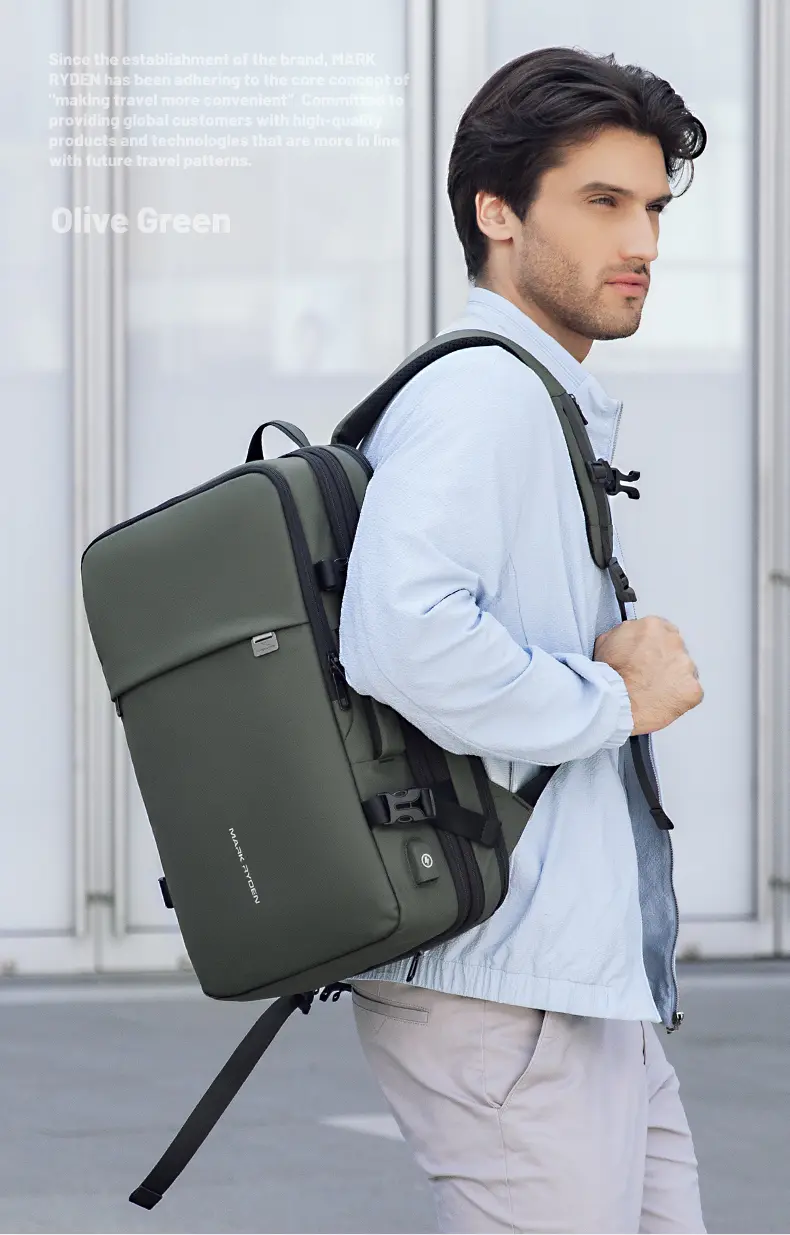 Man carrying Mark Ryden MR8057 laptop backpack in olive green
